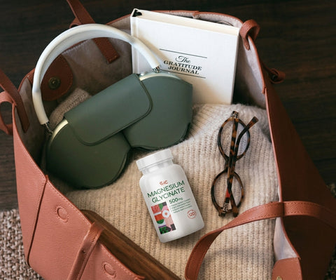 VHC LAB Magnesium Glycinate 500mg in a travel bag with a journal and evening essentials.